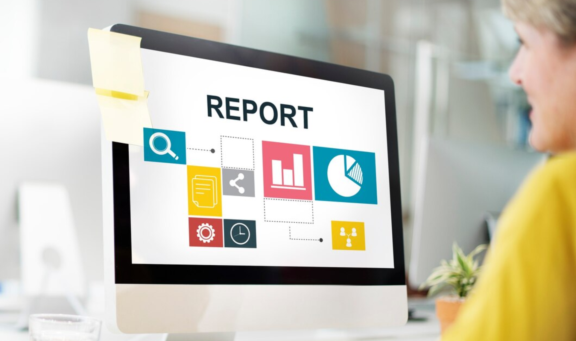 Computer screen displaying REPORT and icons for graphs, documents, and data analysis, representing Detailed Reporting.