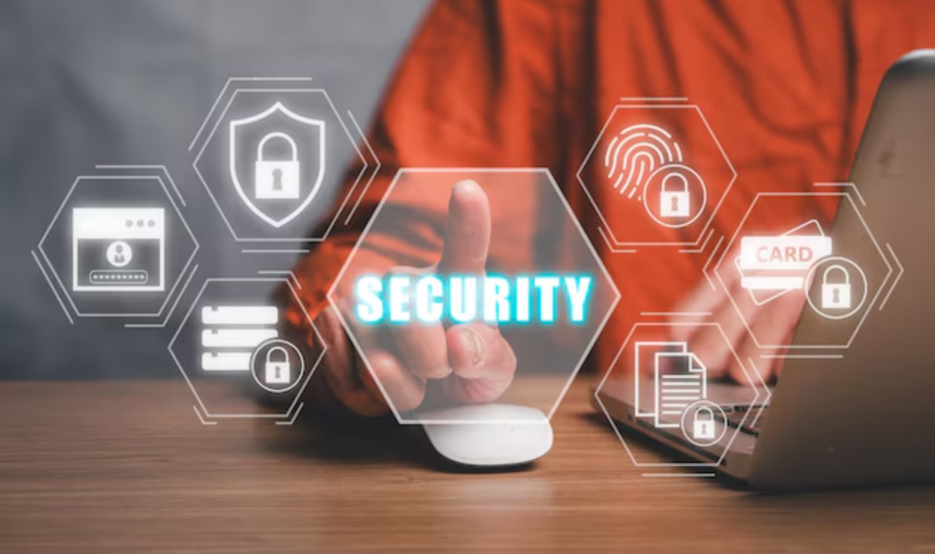 Person using a computer with digital security icons such as locks, shields, and fingerprint authentication displayed around them - Security-First Design.